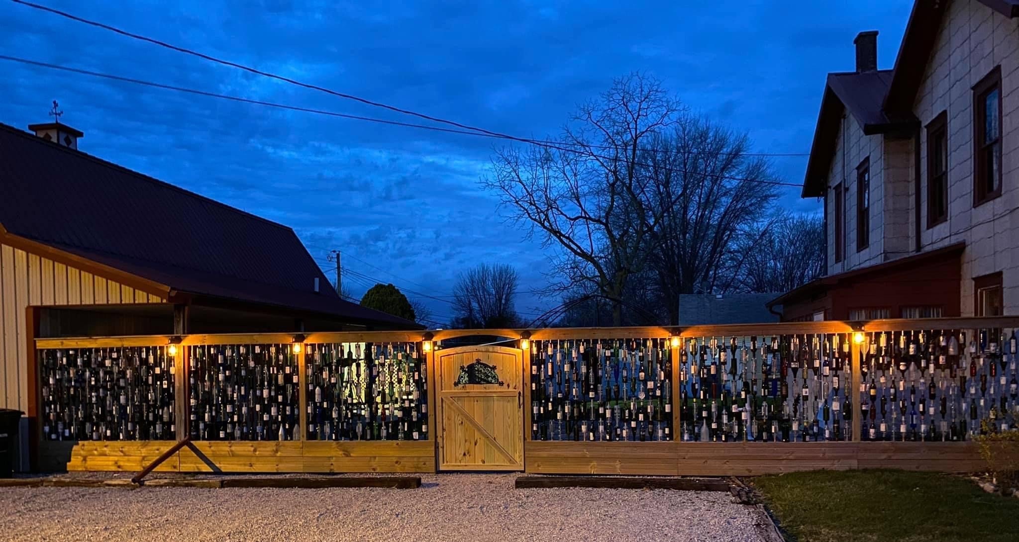 Brad built this wine bottle fence as a statement piece between his house and garage. Local photographers use it as a backdrop.