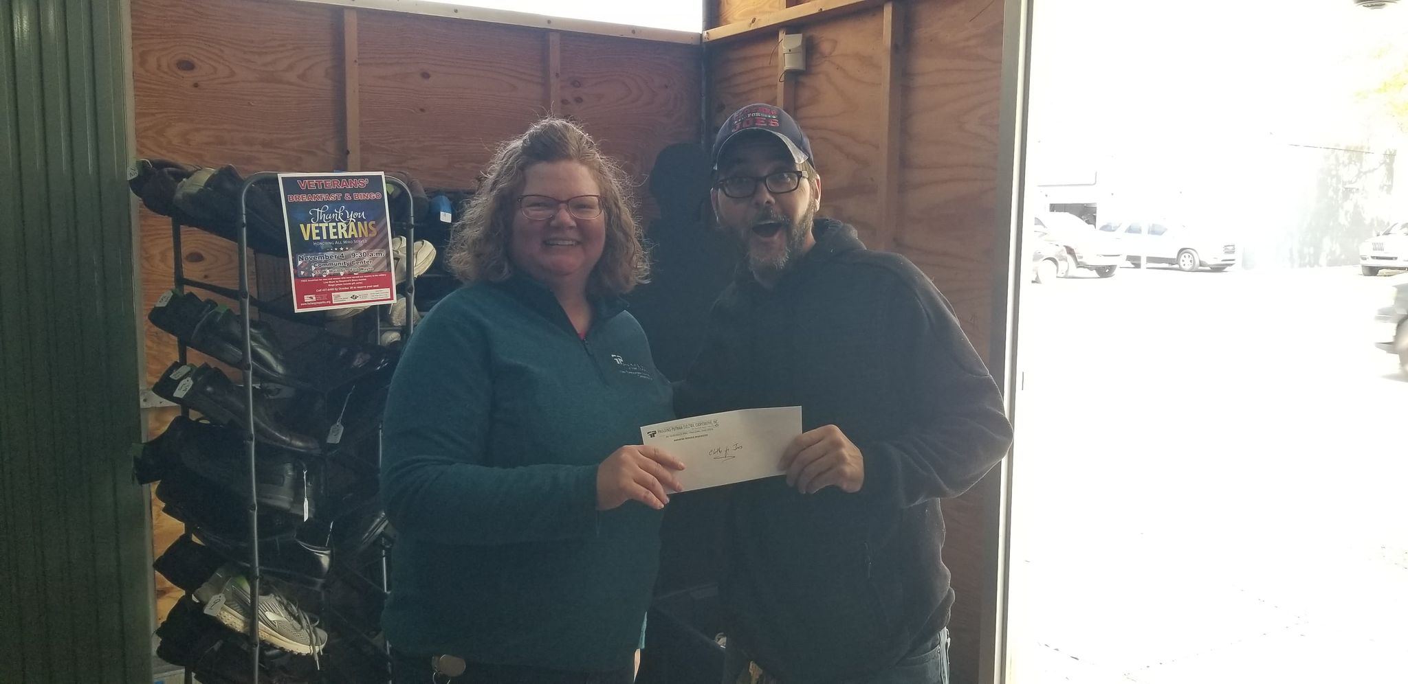 Amy presenting Josh with $400 check from PPEC