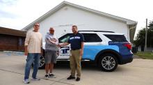 Paulding Putnam Broadband Services Coordinator Luke Burkhart with Grover Hill Lions Club President Jay Denny and Secretary Reg Hinchcliff. The downtown Community Building will receive free Wi-Fi from the co-op as part of the new village partnership.